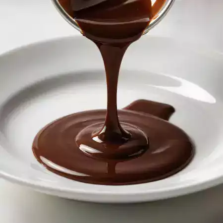 Pourable chocolate sauce made from 50 grams of our dark chocolate with cream and butter perfect for dessert toppings