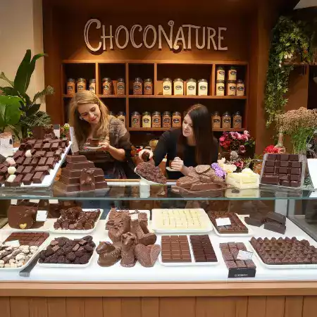 Inside view of ChocoNature chocolate making workshop showing equipment and workspace where Arjun Kavya and Ramesh produce handmade bars
